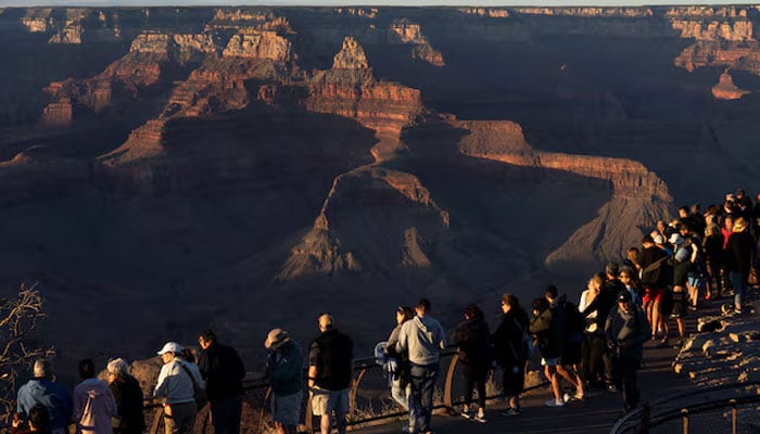 Tourists gather to watch the sunset over the south rim of Grand Canyon National Park near Tusayan, Arizona, U.S., May 16, 2025. — Reuters