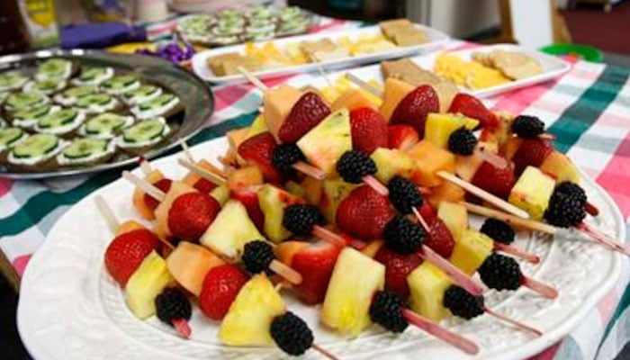 The food at the Lookout Mountain Preschool including fruit kabobs are readied for a healthy school party for Mothers Day in Golden, Colorado in this photo from May 10, 2012. — Reuters