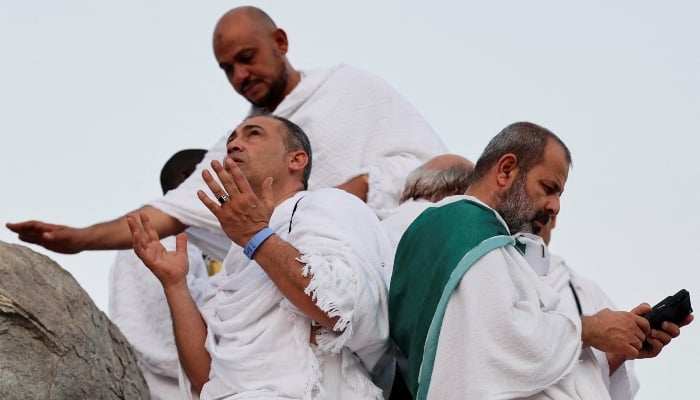 Pilgrims pray at Jabal al-Rahmah, on June 5, 2025. — Reuters