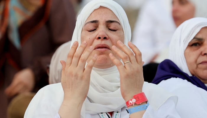 A woman prays at Jabal al-Rahmah, also known as Mount Arafat, during the annual Hajj pilgrimage, on June 5, 2025. — Reuters