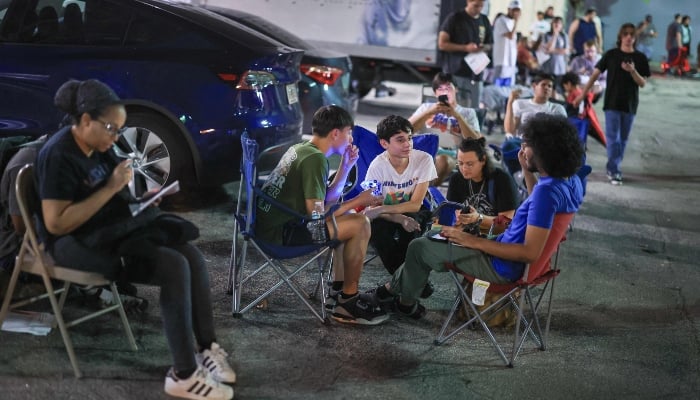 Customers line up outside of a Best Buy store waiting for the midnight opening to purchase Nintendos Switch 2 console on June 05, 2025 in Pembroke Pines, Florida, US. — AFP