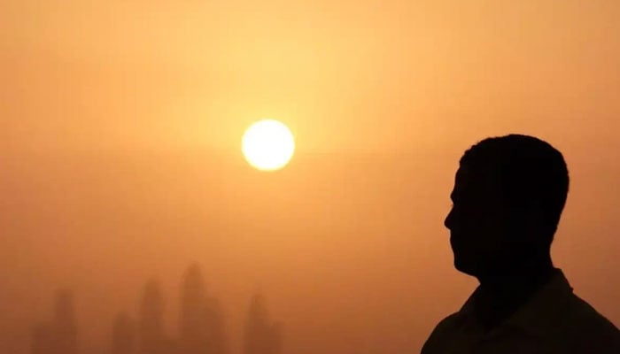 This representational photo shows a man enduring the scorching sun. — Reuters/File