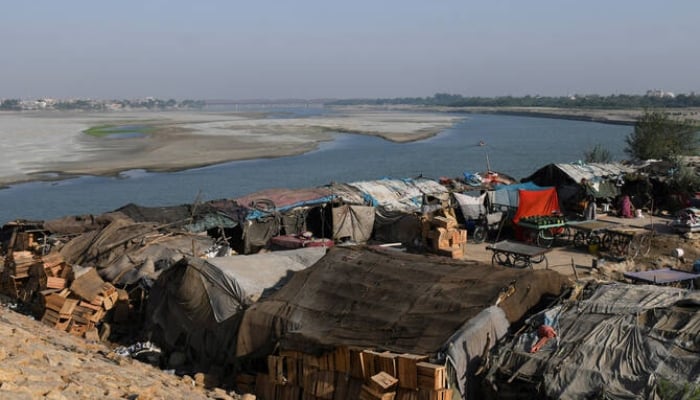 A view of tent houses, belonging to squatters, on the dry riverbed of the Indus River in Hyderabad, on April 25, 2025. — Reuters