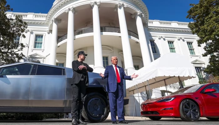 US President Donald Trump talks to the media next to Tesla CEO Elon Musk, with Tesla cars in the background, at the White House in Washington, DC, US, on March 11, 2025. — Reuters