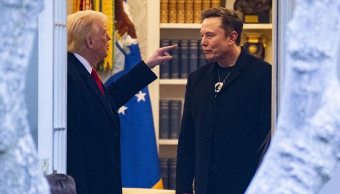US President Donald Trump and Elon Musk speak in the Oval Office before departing the White House in Washington, DC, US on March 14, 2025. — AFP