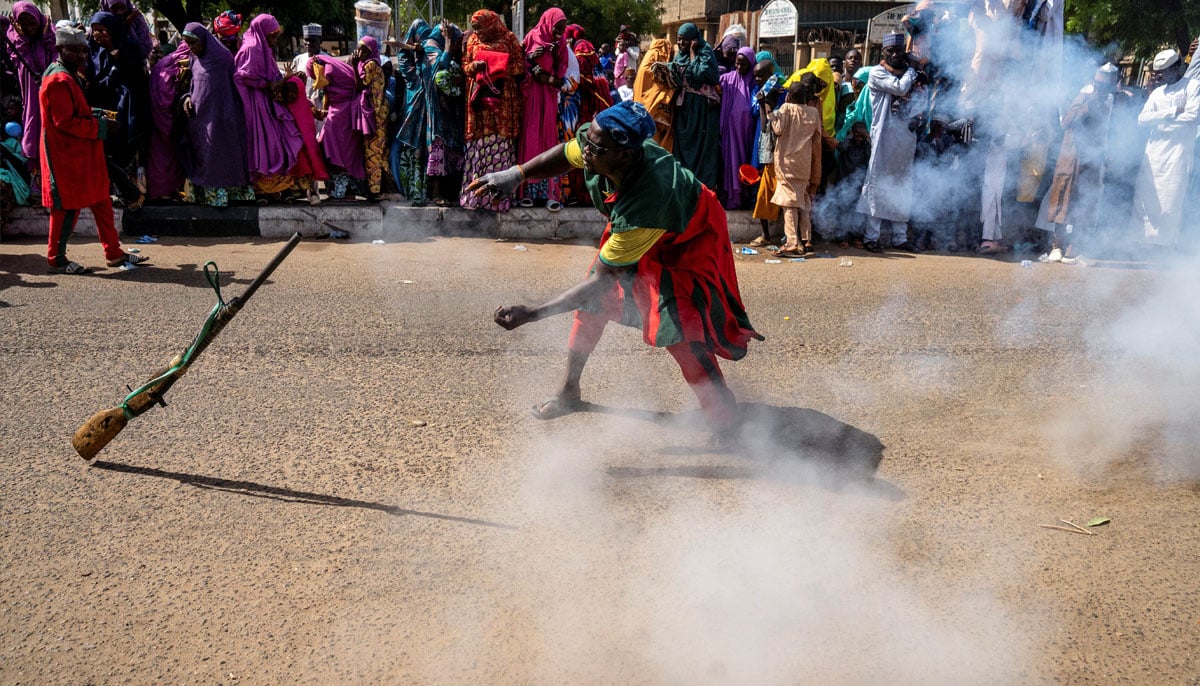 A local hunter juggles a gun in celebration, on the day of the arrival of Muhammadu Sanusi II, Emir of Kano State, on the first day of the Muslim holiday of Eid ul Adha, in Kano, Nigeria, June 6, 2025. — Reuters