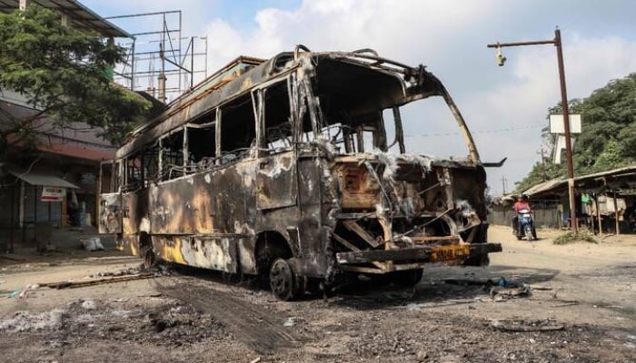 A picture of burned out bus after violence broke out in the streets of Manipur, India. — AFP/File