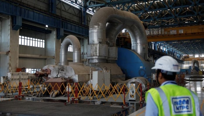 An employee is seen inside the NTPC (National Thermal Power Corporation) power plant in Solapur, India, March 2, 2025. — Reuters