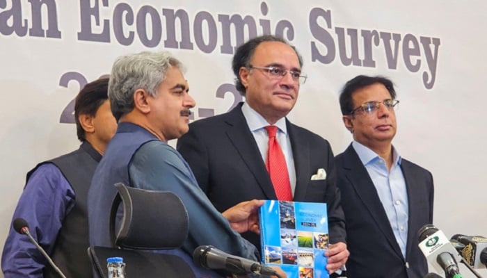 Finance Minister Muhammad Aurangzeb shows a copy of the economic survey of fiscal year 2024-2025 during a news conference in Islamabad, Pakistan June 9, 2025.— Reuters