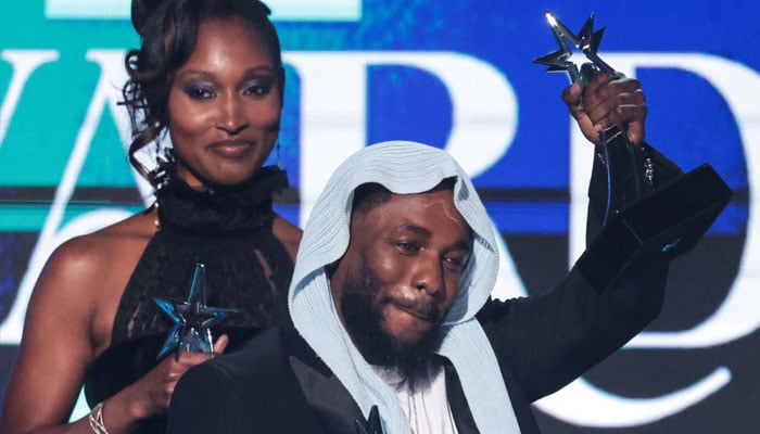 Kendrick Lamar reacts on stage after receiving multiple awards at the 25th annual BET (Black Entertainment Television) Awards, in Los Angeles, California, U.S. June 9, 2025. REUTERS/Mario Anzuoni