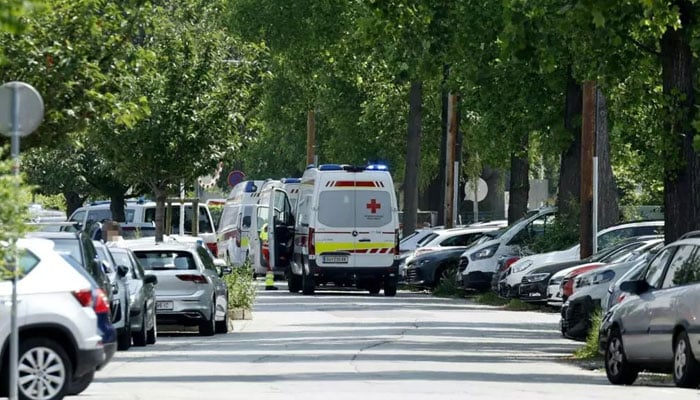 Ambulance vehicles arrive at the scene of a school shooting in Graz, Austria on June 10, 2025. — AFP