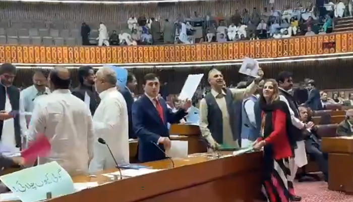 Opposition Leader in the National Assembly Omar Ayub Khan (second from right) along with PTI lawmakers protesting in the National Assembly during the budget session on June 10, 2025. — Screengrab via X/@PTIofficial