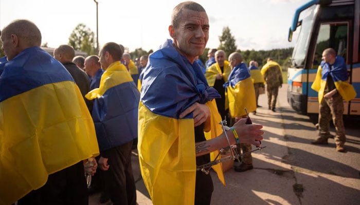 A Ukrainian prisoner of war (POWs) looks on as he stands with others after a swap, amid Russias attack on Ukraine, at an unknown location in Ukraine, in this handout picture released June 10, 2025. — Reuters