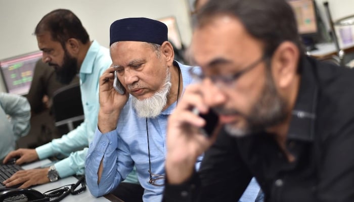 Stockbrokers monitor share prices at the Pakistan Stock Exchange in Karachi, April 8, 2025. — INP