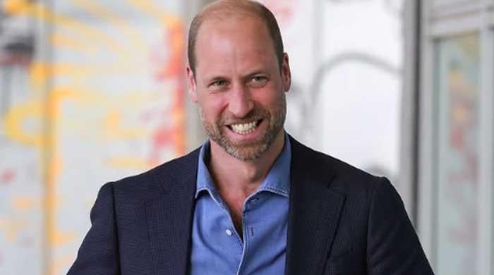 Prince William looks dashing as he attends Windsor Castle ceremony 