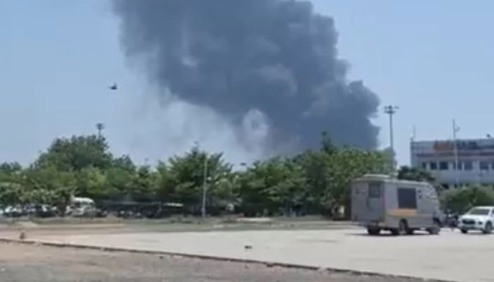 Thick plumes of smoke billowing from the planes wreckage can be seen in this still taken from a video. — Screengrab/YouTube