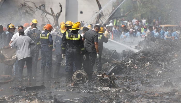 Firefighters work to put out smouldering wreckage at the site where an Air India Boeing 787 Dreamliner plane crashed in Ahmedabad, India, June 12, 2025. — Reuters
