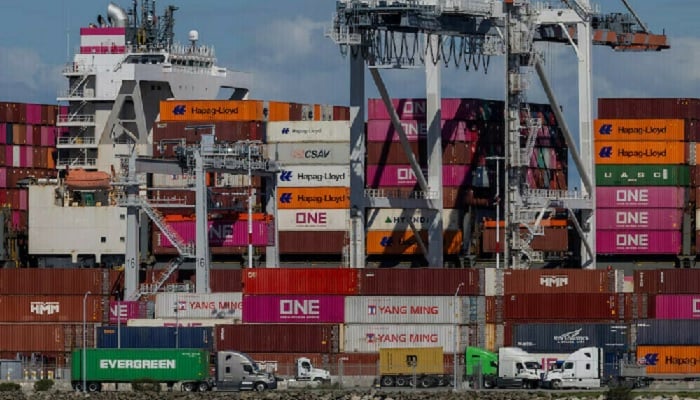 Containers stacked at a port, highlighting trade activity. — Reuters/File