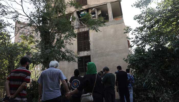 People gather near a damaged building, in the aftermath of Israeli strikes, in Tehran, Iran, June 13, 2025. — Reuters