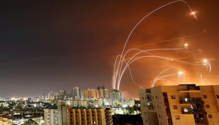 Streaks of light are seen as Israels Iron Dome anti-missile system intercepts rockets launched from the Gaza Strip towards Israel, as seen from Ashkelon, Israel, May 12. — Reuters
