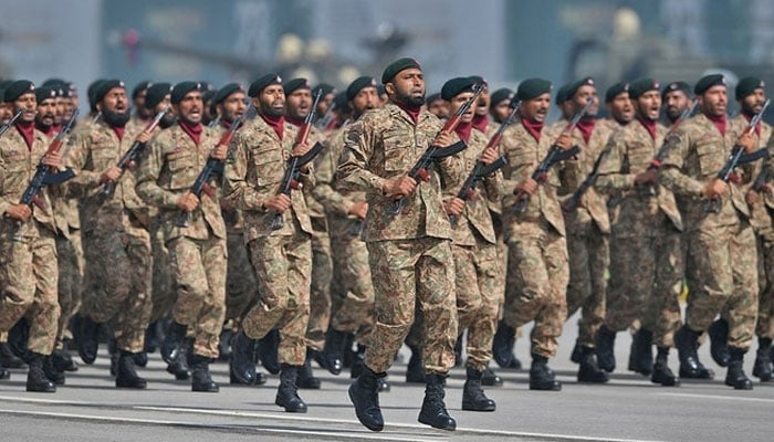 Soldiers march during a military parade on  Pakistan Day in Islamabad. — AFP/File
