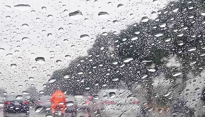Representational image of raindrops seen through a cars windscreen. — INP