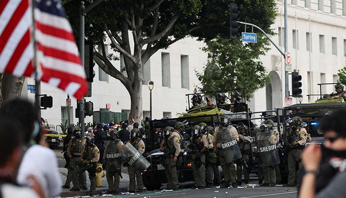 Police officers stand guard during a No Kings Day protest against President Donald Trumps policies, in Los Angeles, California, US on June 14, 2025. — Reuters