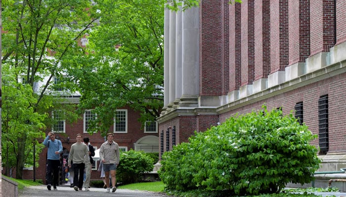 Students walk on the campus of Harvard University in Cambridge, Massachusetts, US, May 23, 2025. — Reuters