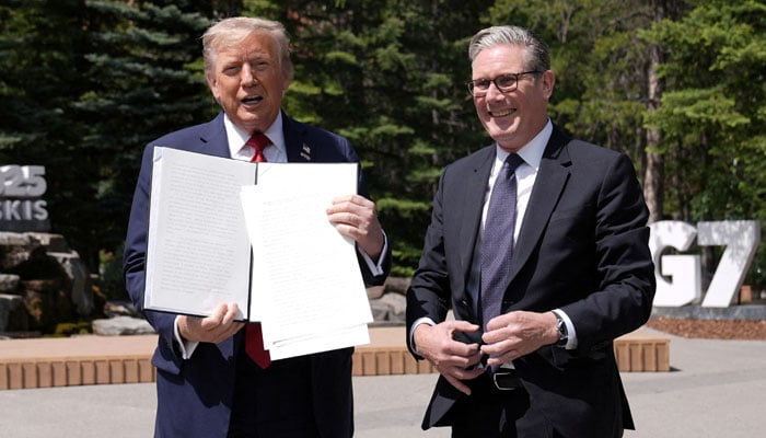 US President Donald Trump holds a signed Trade Agreement with Britain during a meeting with British Prime Minister Keir Starmer, at the G7 summit, in Kananaskis, Alberta, Canada June 16, 2025. — Reuters