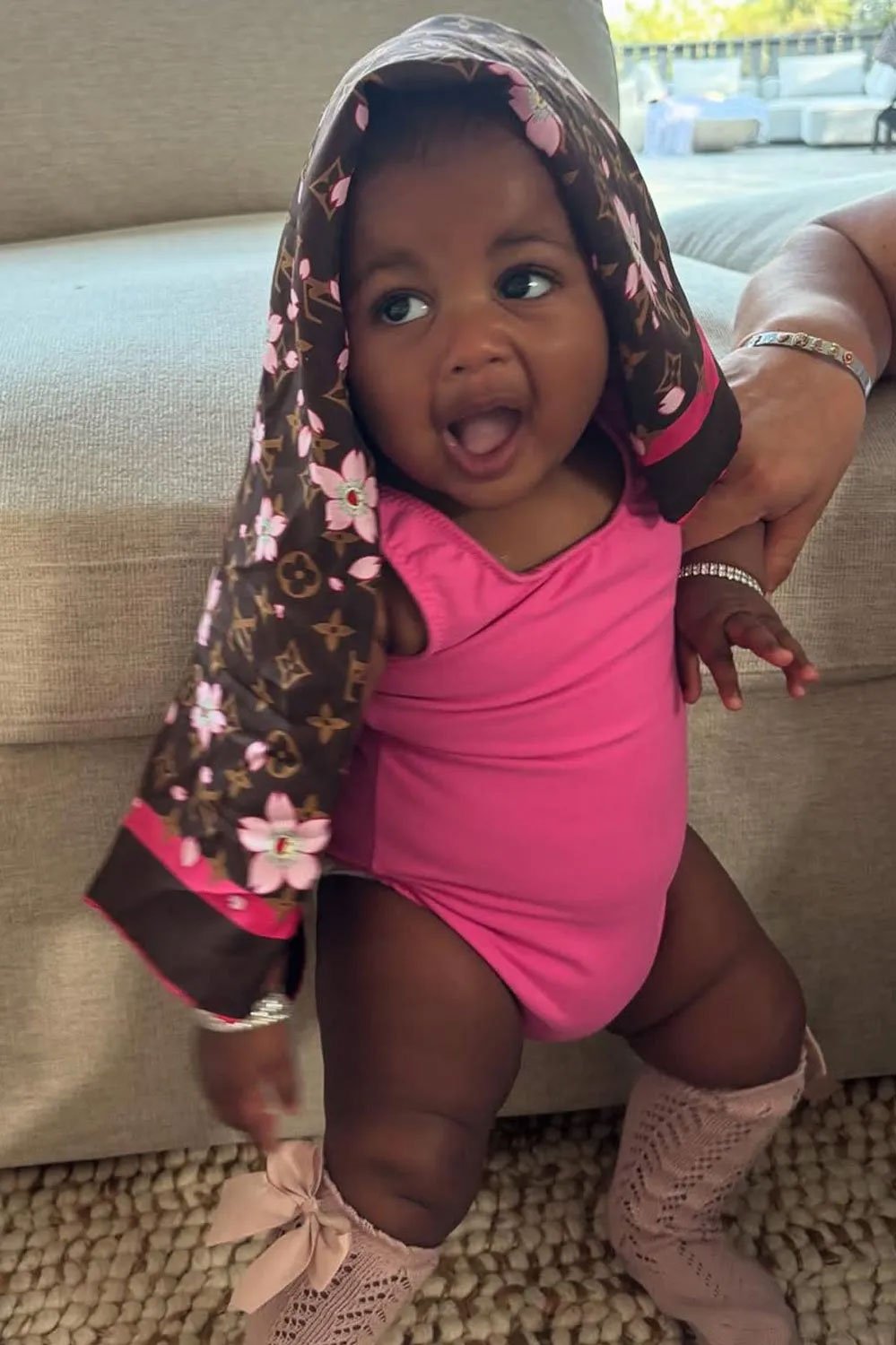 Cardi B reveals daughter Blossoms face for first time in family photos