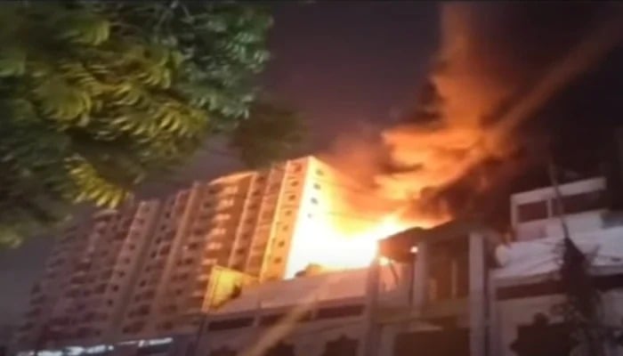 A fire can be seen at a shopping mall on Rashid Minhas Road in Karachi, June 18, 2025. — Screengrab via Geo News