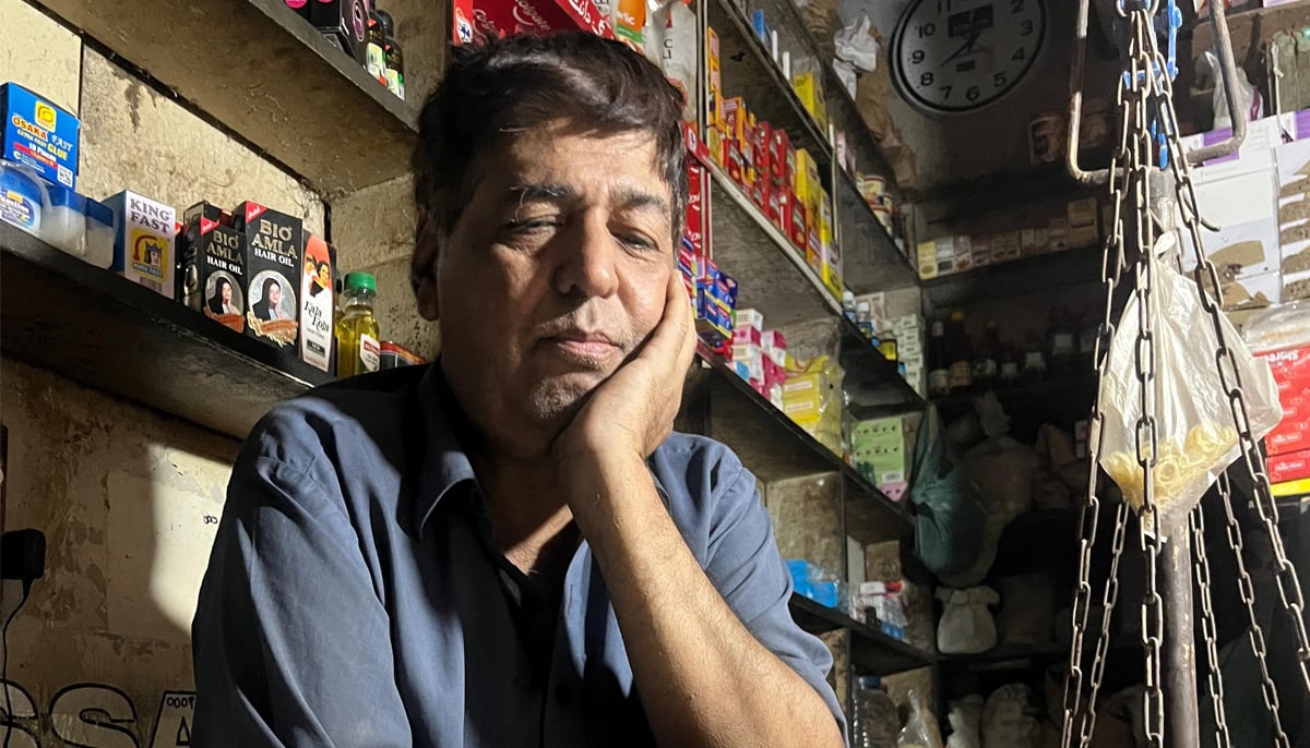 Gullu Bhai sits inside his kiryana stre. — Photo by author