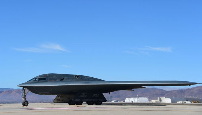 A B-2 Stealth Bomber, which is the only military aircraft capable of deploying the GBU-57, pulls up on the runway after landing at the Palmdale Aircraft Integration Center of Excellence in Palmdale, California on July 17, 2014. — AFP