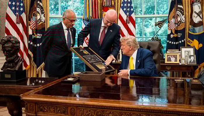 President Donald Trump speaks with FIFA President Gianni Infantino as he meets with members of the Juventus Football Club team in the Oval Office, Washington, D.C., U.S., June, 18, 2025. — Reuters