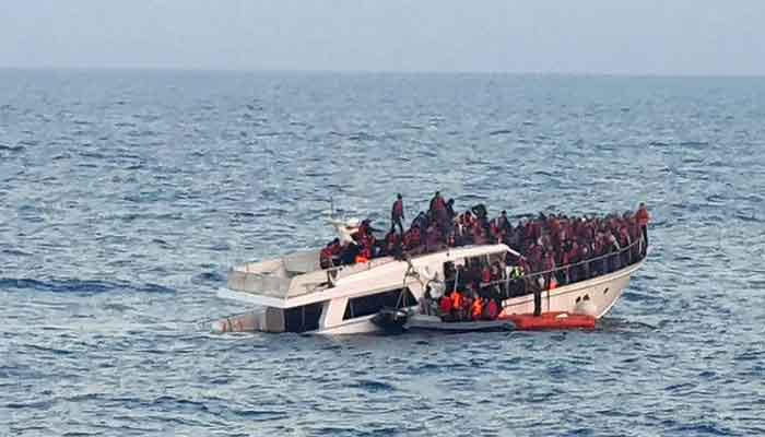 A photo from a handout supplied by the Lebanese Army on December 31, 2022, depicts a migrant boat drowning in Mediterranean waters off the countrys northern coast close to Tripoli when the Lebanese navy was conducting a rescue effort. — AFP