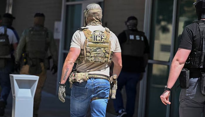 Masked law enforcement officers, including HSI and ICE agents, walk into an immigration court in Phoenix, Arizona, US, May 21, 2025. — Reuters