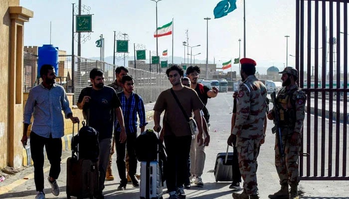 Iranian cargo trucks cross into the Pakistan-Iran border at Taftan, Balochistan province on June 18, 2025, amid the ongoing conflict between Israel and Iran. — AFP/File