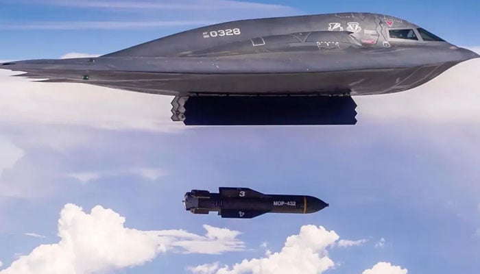 A B-2 bomber drops a GBU-57/B MOP during a test. — USAF/File