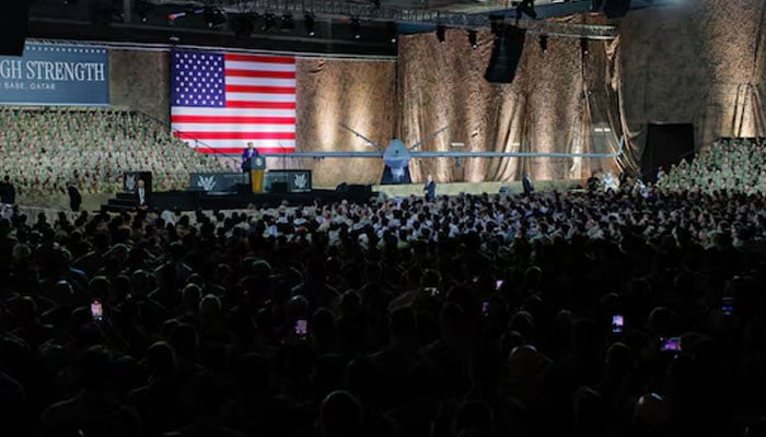 US President Donald Trump delivers remarks to US troops, next to a banner reading, Peace Through Strength, during a visit to Al Udeid Air Base in Doha, Qatar, May 15, 2025. — Reuters