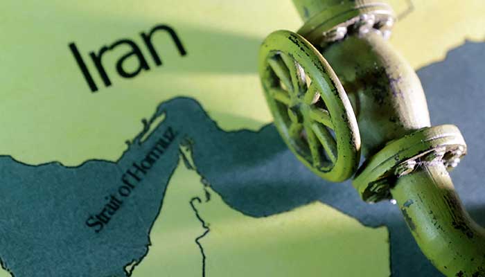 A map showing the Strait of Hormuz and Iran is seen behind a 3D printed oil pipeline in this illustration taken June 22, 2025. — Reuters