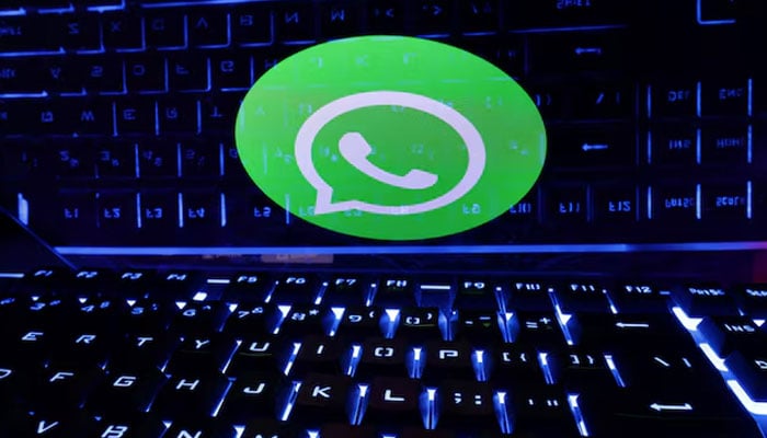 A keyboard is placed in front of a displayed WhatsApp logo in this illustration taken February 21, 2023. — Reuters