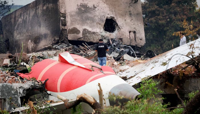A fire officer stands next to the crashed Air India Boeing 787-8 Dreamliner aircraft, in Ahmedabad, India on June 13, 2025. — Reuters