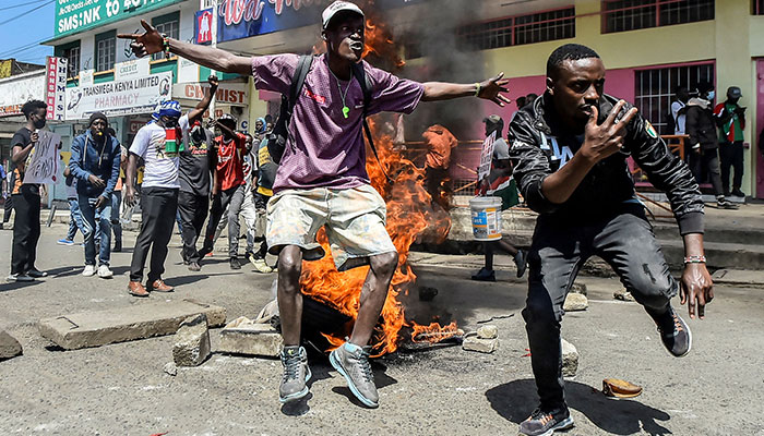 Protesters react next to burning tyres during demonstrations to mark the first anniversary of the deadly 2024 anti-government protests that drew widespread condemnation over the use of force by security agencies, in Nakuru, Kenya June 25, 2025. — Reuters