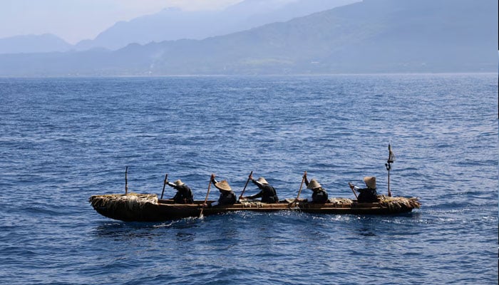 A dugout canoe with four men and one woman paddling is pictured during a crossing across a region of the East China Sea from near Ushibi, Taiwan to Yonaguni Island, traversing the Kuroshio current, in this handout image released on June 25, 2025. — Reuters