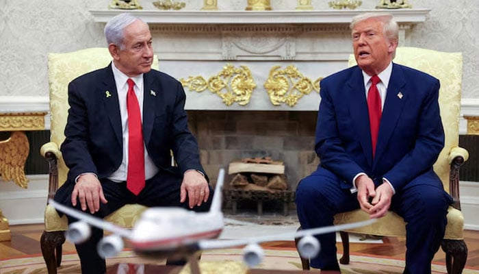 President Donald Trump talks to Israeli Prime Minister Benjamin Netanyahu during a meeting where Trump announced nuclear talks with Iran, Washington, US, April 7, 2025. — Reuters