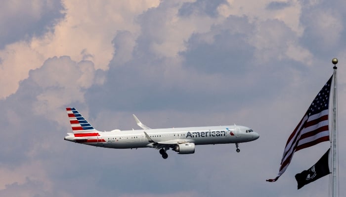 An American Airlines commercial aircraft flies over Washington as it approaches to land at Dulles International Airport, as seen from Washington, US, August 5, 2024. — Reuters
