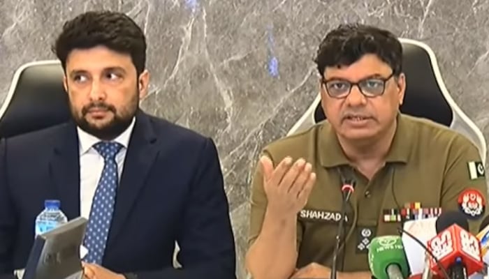 Punjab AIG Operations Shehzada Sultan (right) speaks during a press conference. — Screengrab via Geo News