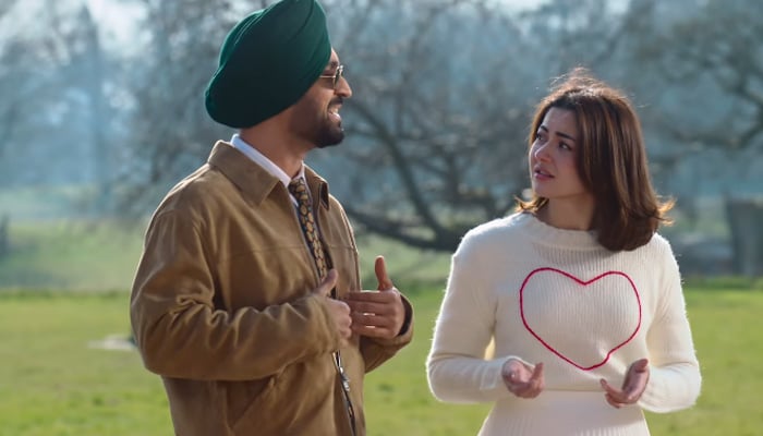 Diljit Dosanjh and Hania Aamir in a still taken from Sardaar Ji 3s trailer. — Instagram@haniaheheofficial