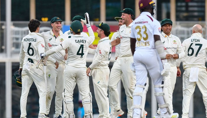 Australia players celebrate winning on the 3rd day of the 1st Test match between West Indies and Australia at Kensington Oval, Bridgetown, Barbados, on June 27, 2025. — AFP