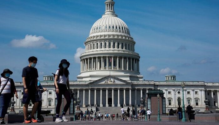 People walk past the US Capitol in Washington, US. — Reuters/File